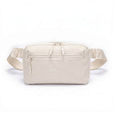 Zeeksack Crossbody Organizer (sandbeige) – Schultergurt und Reißverschlussfach vorne.